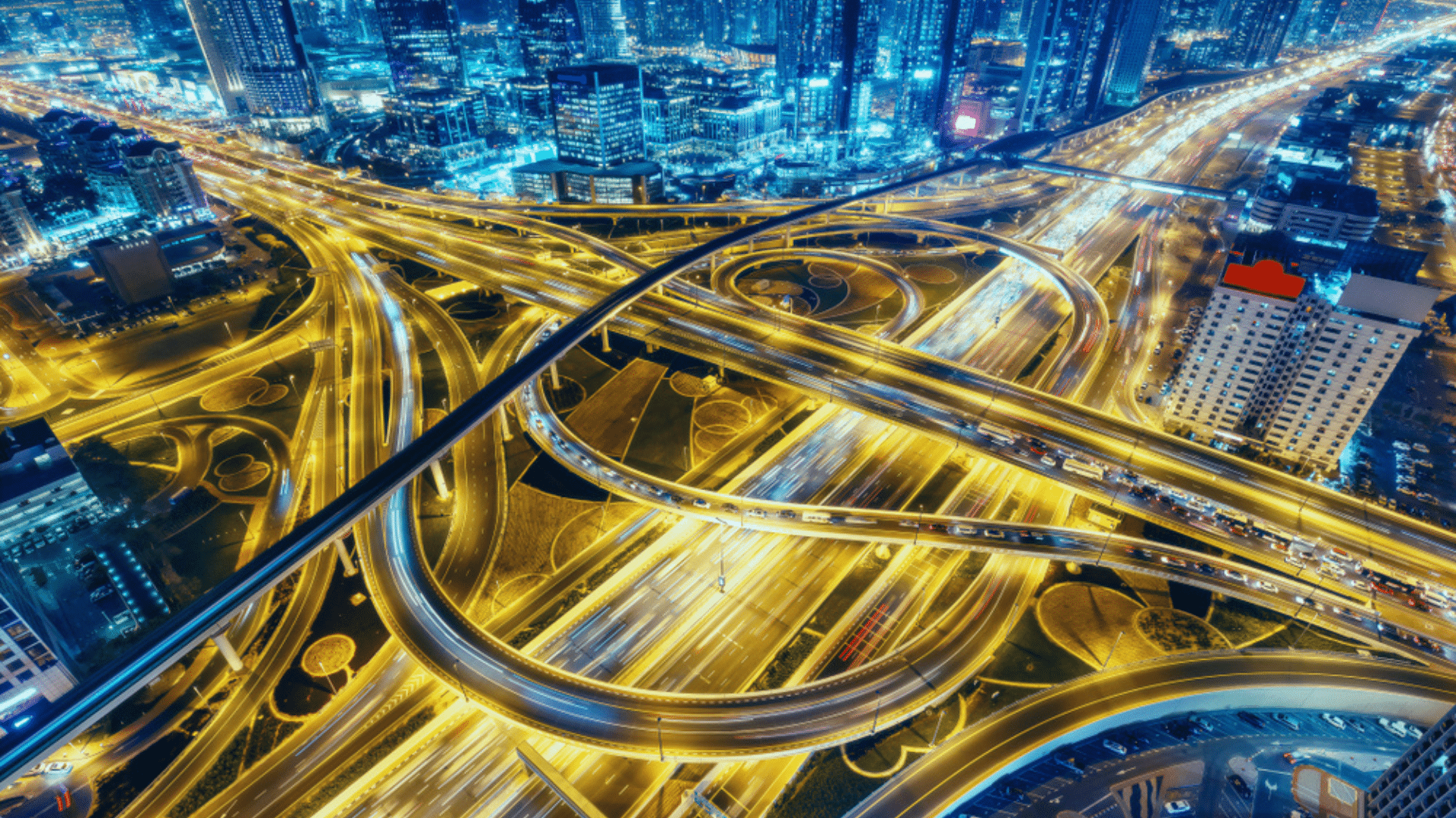 Aerial View of Big Highway Interchange with Traffic at Night